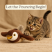 Cat playing with motion-activated flapping bird toy